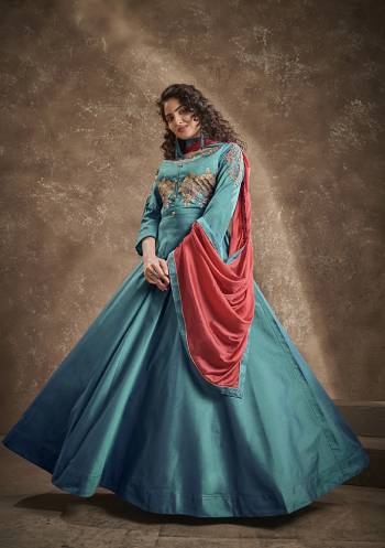 Flaunt Your Rich And Elegant Taste Wearing This Designer Readymade Long Gown In Dark Cyan Color With Pink Color Dupatta. This  Pretty Gown Is Fabricated On Triva Silk With Inner Beautified With Thread Work And Cinon Fabriced Dupatta. Its Fabric Is Soft Towards Skin And Easy To Carry All Day Long. 