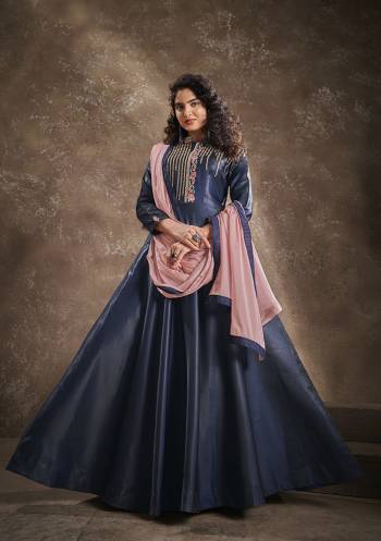 Flaunt Your Rich And Elegant Taste Wearing This Designer Readymade Long Gown In Nevy Blue Color With Peach Color Dupatta. This  Pretty Gown Is Fabricated On Triva Silk With Inner Beautified With Thread Work And Cinon Fabriced Dupatta. Its Fabric Is Soft Towards Skin And Easy To Carry All Day Long. 