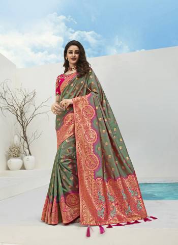 For A Proper Traditional Look, Grab This Designer Silk Based Heavy Weaved Saree In Dark Fine Color. This Saree Are Banarasi Silk Wevon Jacquard And Blouse Are Fabricated On Raw Silk Beautified With Heavy Embroidery And Stone Work. Buy Now