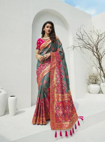 For A Proper Traditional Look, Grab This Designer Silk Based Heavy Weaved Saree In Dark Fine Color. This Saree Are Banarasi Silk Wevon Jacquard And Blouse Are Fabricated On Raw Silk Beautified With Heavy Embroidery And Stone Work. Buy Now