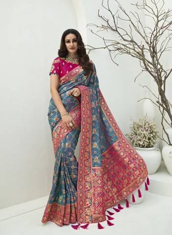 For A Proper Traditional Look, Grab This Designer Silk Based Heavy Weaved Saree In Dark Fine Color. This Saree Are Banarasi Silk Wevon Jacquard And Blouse Are Fabricated On Raw Silk Beautified With Heavy Embroidery And Stone Work. Buy Now