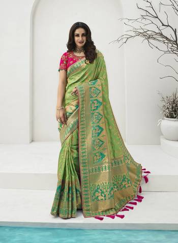 For A Proper Traditional Look, Grab This Designer Silk Based Heavy Weaved Saree In Dark Fine Color. This Saree Are Banarasi Silk Wevon Jacquard And Blouse Are Fabricated On Raw Silk Beautified With Heavy Embroidery And Stone Work. Buy Now