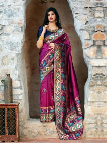 Adorn The Pretty Angelic Look Wearing This Heavy Weaving Designer Saree In Purple Color Paired With Contrasting Nevy Blue Colored Blouse. This Saree Is Fabricated On Patola Silk Paired With Blouse. Its Pretty Color Pallete Will Give An Attractive Look To Your Personality. 