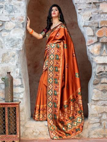 Adorn The Pretty Angelic Look Wearing This Heavy Weaving Designer Saree In Orange Color Paired With Contrasting Maroon Colored Blouse. This Saree Is Fabricated On Patola Silk Paired With Blouse. Its Pretty Color Pallete Will Give An Attractive Look To Your Personality. 