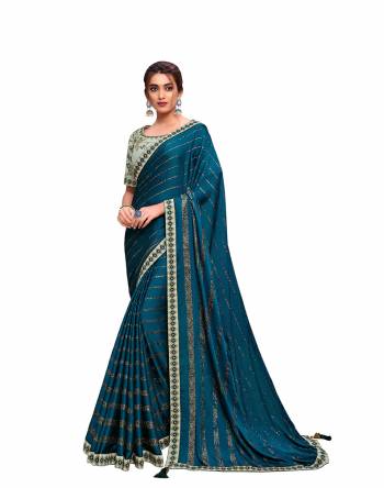 Adorn The Pretty Angelic Look Wearing This Heavy Designer Saree In Fine Paired With Contrasting Colored Blouse. This Saree Is Fabricated On Chiffon Paired With Raw Silk Fabricated Blouse. Its Pretty Color Pallete Will Give An Attractive Look To Your Personality. 