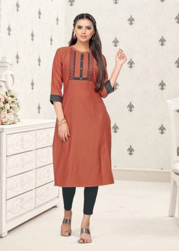 Grab This Readymade Long Kurti In Rust Color Fabricated On Cotton Beautified With Prints. It Is Light In Weight And Easy To Carry All Day Long. 