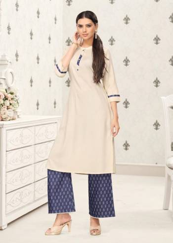 This Readymade Long Kurti & Bottom In Creem Color Fabricated Top And Nevy Blue Bottom On Cotton Top And Denin Bottom Beautified With Plain. It Is Light In Weight And Easy To Carry All Day Long. 