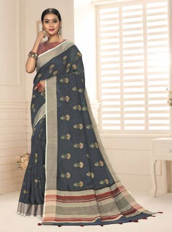 Grab This Pretty Elegant Looking Designer Saree In Dusty Color Paired With Contrasting Colored Blouse. This Saree And Blouse Are Linen Based Beautified With Weaving Designer. Buy Now.