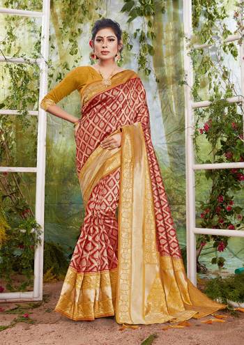 Flaunt Your Rich And Elegant Taste In This Maroon Colored Saree Paired With Golden Colored Blouse. This Saree And Blouse Are Fabricated On Silk Beautified With Weave. Buy This Saree Now.