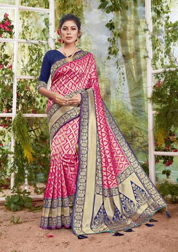 Flaunt Your Rich And Elegant Taste In This Pink Colored Saree Paired With Nevy Blue Colored Blouse. This Saree And Blouse Are Fabricated On Silk Beautified With Weave. Buy This Saree Now.