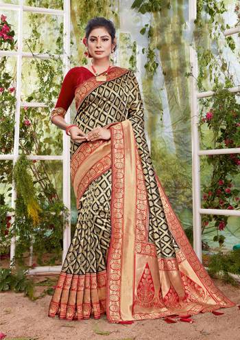 Flaunt Your Rich And Elegant Taste In This Black Colored Saree Paired With Maroon Colored Blouse. This Saree And Blouse Are Fabricated On Silk Beautified With Weave. Buy This Saree Now.