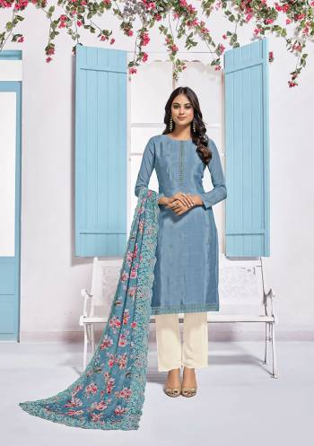 Grab This Very Pretty Designer Straight Suit In Grey Colored Top Paired With White Colored Bottom And Grey Colored Dupatta. Its Top Is Fabricated On Chinon Paired With Crepe Bottom And Chiffon Fabricated Dupatta. Its Pretty Floral Prints And Tone To Tone Embroidery Gives An Elegant Look To Your Personality. 