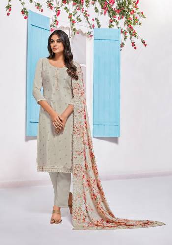 Grab This Very Pretty Designer Straight Suit In Grey Colored Top Paired With White Colored Bottom And Grey Colored Dupatta. Its Top Is Fabricated On Chinon Paired With Crepe Bottom And Chiffon Fabricated Dupatta. Its Pretty Floral Prints And Tone To Tone Embroidery Gives An Elegant Look To Your Personality. 