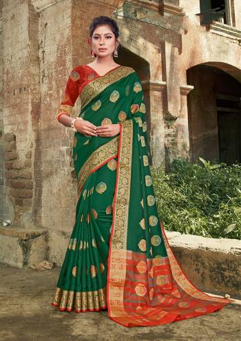 For A Proper Traditional Look, Grab This Heavy Weaved Silk Based?Designer Saree In Green Color Paired with Red Colored Blouse. This Saree and Blouse Are Fabricated On Silk Which Gives A Rich Look To Your Personality