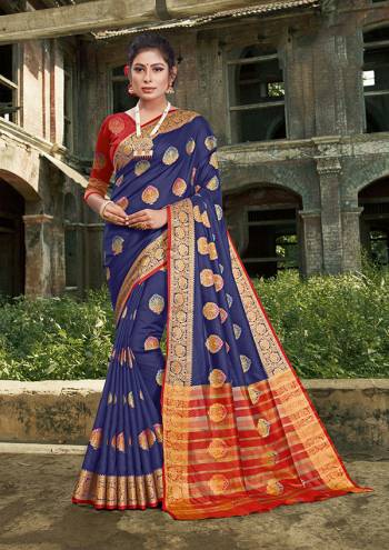 For A Proper Traditional Look, Grab This Heavy Weaved Silk Based?Designer Saree In Nevy Blue Color Paired with Red Colored Blouse. This Saree and Blouse Are Fabricated On Silk Which Gives A Rich Look To Your Personality