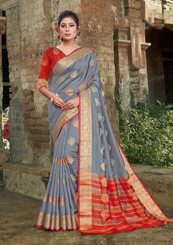 For A Proper Traditional Look, Grab This Heavy Weaved Silk Based?Designer Saree In Grey Color Paired with Red Colored Blouse. This Saree and Blouse Are Fabricated On Silk Which Gives A Rich Look To Your Personality