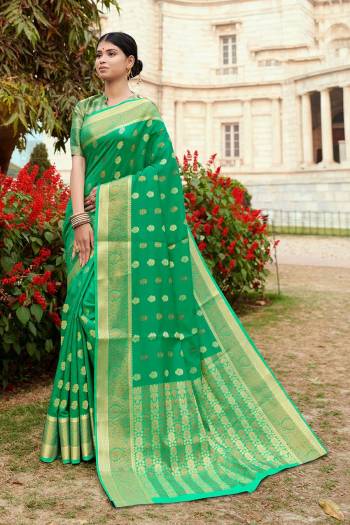 Here Is A Pretty Designer Saree In Sea Green Color Paired With Sea Green Colored Blouse. This Saree And Blouse Are Fabricated On Silk Beautified With Weaved Motifs And Broad Border.