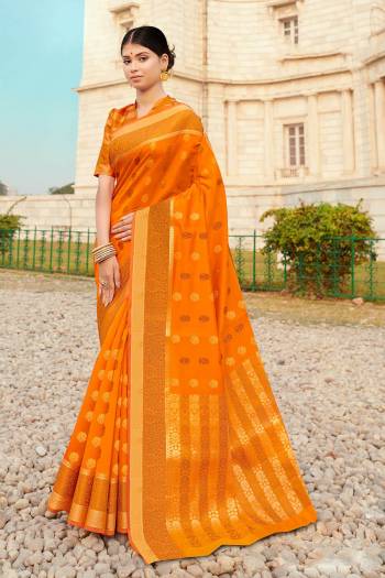 Here Is A Pretty Designer Saree In Orange Color Paired With Golden Colored Blouse. This Saree And Blouse Are Fabricated On Silk Beautified With Weaved Motifs And Broad Border.