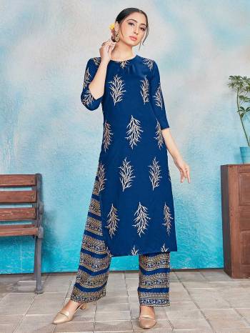 This Designer Readymade Suit In Lovely Dark Color.?Its Pretty Foil Print Top Is Rayon Based Paired With Rayon Bottom. Which Gives An Attractive To The Suit.