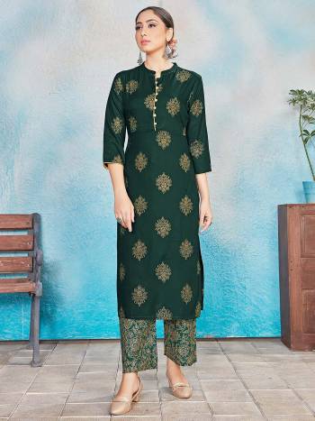 This Designer Readymade Suit In Lovely Dark Color.?Its Pretty Foil Print Top Is Rayon Based Paired With Rayon Bottom. Which Gives An Attractive To The Suit.