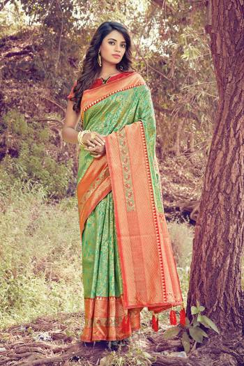 Grab This Heavy Weaved Silk Based?Designer Saree In Sea Green Color Paired with Red Colored Blouse. This Saree and Blouse Are Fabricated On Silk Which Gives A Rich Look To Your Personality