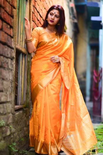 Celebrate This Festive Season In This Very Pretty Musterd Colored Designer Saree Paired With Contrasting Musterd Colored Blouse. This Saree and Blouse Are Assam Silk Based Beautified With Wevon Jari Designer Saree. 