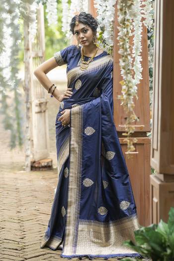 Look Attractive Wearing This Saree Paired With Blouse.  This Heavy Wevon Jari Designer Saree Is Banarasi Silk Based Which Gives A Rich Look To Your Personality. Buy This Pretty Saree Now.