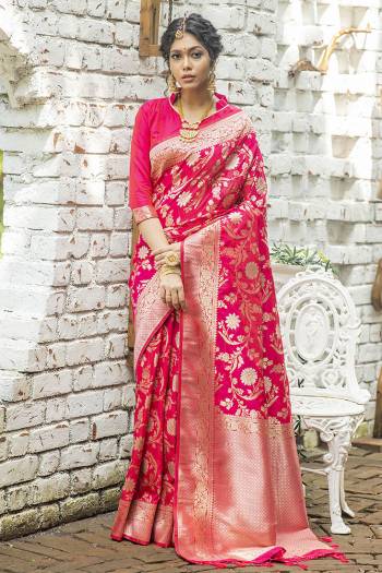 Look Attractive Wearing This Saree Paired With Blouse.  This Heavy Wevon Jari Designer Saree Is Banarasi Silk Based Which Gives A Rich Look To Your Personality. Buy This Pretty Saree Now.