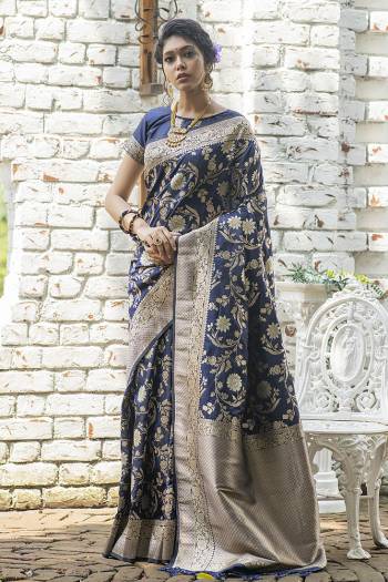 Look Attractive Wearing This Saree Paired With Blouse.  This Heavy Wevon Jari Designer Saree Is Banarasi Silk Based Which Gives A Rich Look To Your Personality. Buy This Pretty Saree Now.