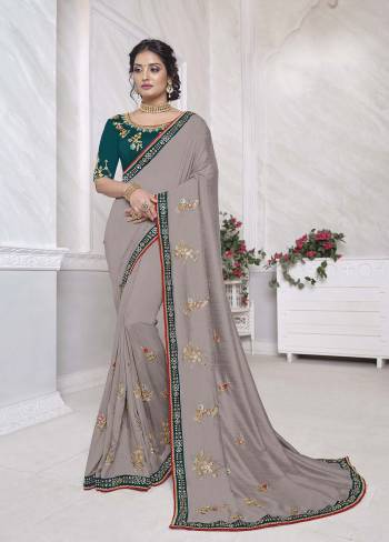 Adorn The Pretty Angelic Look Wearing This Heavy Designer Saree In Fine Color Paired With Contrasting Colored Blouse. This Saree Is Fabricated On Vichitra Silk Paired With Dupian Fabricated Blouse. Its Pretty Color Pallete Will Give An Attractive Look To Your Personality. 