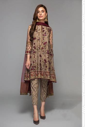 Grab This Beautiful Heavy Designer Pakistani Straight Suit In Light Color Paired With Maroon Colored Dupatta. Its Heavy Embroidered And Diamond Work Top Is Fabricated On Faux Georgette Paired With Santoon Bottom and Butterfly Net Fabricated Dupatta. 

