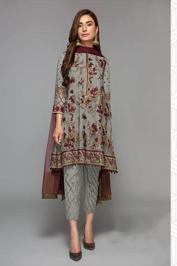 Grab This Beautiful Heavy Designer Pakistani Straight Suit In Light Color Paired With Maroon Colored Dupatta. Its Heavy Embroidered And Diamond Work Top Is Fabricated On Faux Georgette Paired With Santoon Bottom and Butterfly Net Fabricated Dupatta. 

