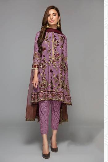 Grab This Beautiful Heavy Designer Pakistani Straight Suit In Light Color Paired With Maroon Colored Dupatta. Its Heavy Embroidered And Diamond Work Top Is Fabricated On Faux Georgette Paired With Santoon Bottom and Butterfly Net Fabricated Dupatta. 

