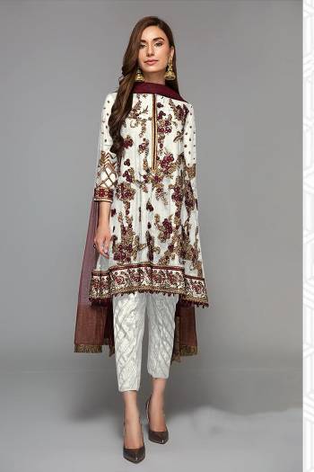 Grab This Beautiful Heavy Designer Pakistani Straight Suit In Light Color Paired With Maroon Colored Dupatta. Its Heavy Embroidered And Diamond Work Top Is Fabricated On Faux Georgette Paired With Santoon Bottom and Butterfly Net Fabricated Dupatta. 

