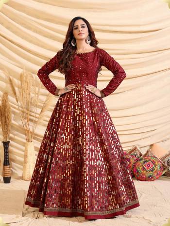 Flaunt Your Rich And Elegant Taste Wearing This Designer Semi Stitched Long Gown In Maroon Color. This  Pretty Gown Is Fabricated On Tafetta Silk Beautified With Pigment Multy Color Foil Print. Its Fabric Is Soft Towards Skin And Easy To Carry All Day Long. 