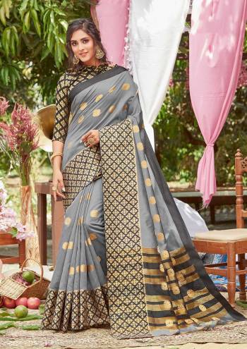 For A Decent And Formal Look, Grab This Pretty Elegant Looking Saree In Dark Color Paired With Contrasting Colored Blouse. This Saree And Blouse Are Fabricated On Crystal Silk Beautified With Broad Weaved Border And Pallu.