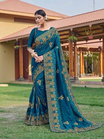 Look Attractive Wearing This Blue Colored Saree Paired With Blue Colored Blouse.  This Heavy Designer Embroidery Saree Is Vichitra Silk Based Which Gives A Rich Look To Your Personality. Buy This Pretty Saree Now.