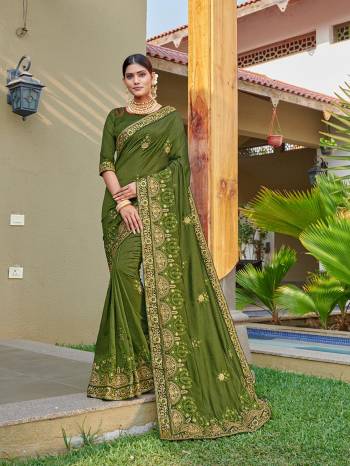 Look Attractive Wearing This Green Colored Saree Paired With Green Colored Blouse.  This Heavy Designer Embroidery Saree Is Vichitra Silk Based Which Gives A Rich Look To Your Personality. Buy This Pretty Saree Now.