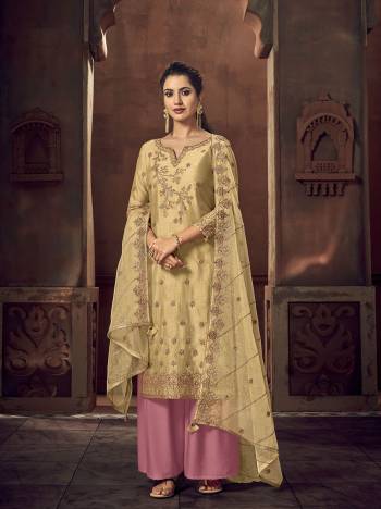 Grab This Beautiful Heavy Designer Straight Suit In Fine Color Paired With Dupatta. Its Heavy Embroidered Work Top Is Fabricated On Rassion Silk Paired With Santoon Bottom and Organza Fabricated Embroidery Dupatta. 

