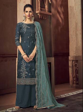 Grab This Beautiful Heavy Designer Straight Suit In Fine Color Paired With Dupatta. Its Heavy Embroidered Work Top Is Fabricated On Rass Silk Paired With Santoon Bottom and Net Fabricated Embroidery Dupatta. 

