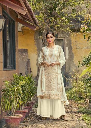 Garb This Beautiful Heavy Designer Straight Suit In Creem Color Paired With Dupatta. Its Heavy Embroidered Work Top Is Fabricated On Faux Georgette Paired With Santoon Bottom and Naznin Fabricated Dupatta. 

