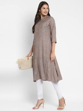 Attrective This Readymade Long Kurti In Fine Color Fabricated On Two Tone Rayon Beautified With Designer Hand Work . It Is Light In Weight And Easy To Carry All Day Long. 