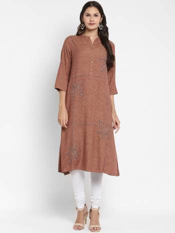 Attrective This Readymade Long Kurti In Fine Color Fabricated On Two Tone Rayon Beautified With Designer Hand Work . It Is Light In Weight And Easy To Carry All Day Long. 