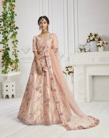 This Season Is About Subtle Shades And Pastel Play So Grab This Designer Heavy Lehenga Choli In Pastel Color Paired With Pastel Colored Dupatta. Its Blouse And Lehenga Are Silk Based Paired With Butterfly Net Fabricated Dupatta