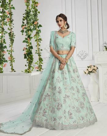 This Season Is About Subtle Shades And Pastel Play So Grab This Designer Heavy Lehenga Choli In Pastel Color Paired With Pastel Colored Dupatta. Its Blouse And Lehenga Are Silk Based Paired With Butterfly Net Fabricated Dupatta