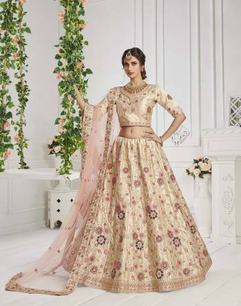 This Season Is About Subtle Shades And Pastel Play So Grab This Designer Heavy Lehenga Choli In Pastel Color Paired With Pastel Colored Dupatta. Its Blouse And Lehenga Are Silk Based Paired With Butterfly Net Fabricated Dupatta