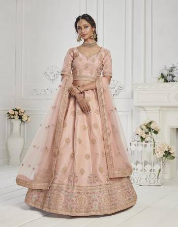 This Season Is About Subtle Shades And Pastel Play So Grab This Designer Heavy Lehenga Choli In Pastel Color Paired With Pastel Colored Dupatta. Its Blouse And Lehenga Are Silk Based Paired With Butterfly Net Fabricated Dupatta