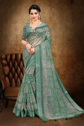 Adorn The Pretty Angelic Look Wearing This Heavy Designer Saree In Fine Color Paired With Blouse. This Saree Is Fabricated On Cotton Slub With Weaving Jari And Printed Paired With Blouse. Its Pretty Color Pallete Will Give An Attractive Look To Your Personality. 