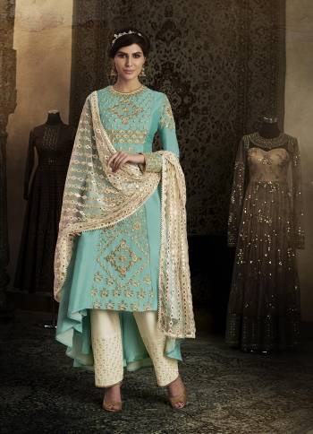 Look Pretty This Designer Floor Length Suit In Lovely  Color.?Its Pretty Embroidred Top Is Silk Based Paired With Santoon Bottom And Net Fabricated Embroidered Dupatta Which Gives An Attractive To The Suit.