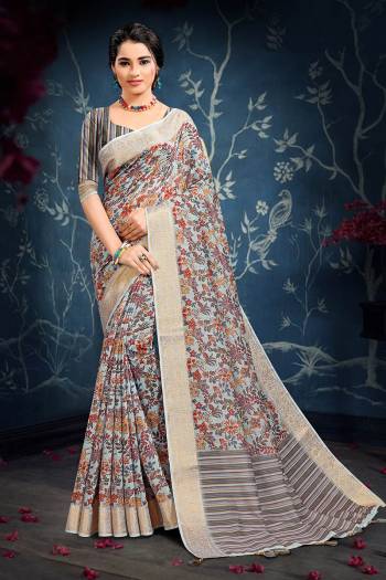 Celebrate This Festive Season In This Very Pretty Dusty Colored Designer Saree Paired With Contrasting Colored Blouse. This Saree and Blouse Are Cotton Based Beautified With Detailed Weving Jacquard Border. 